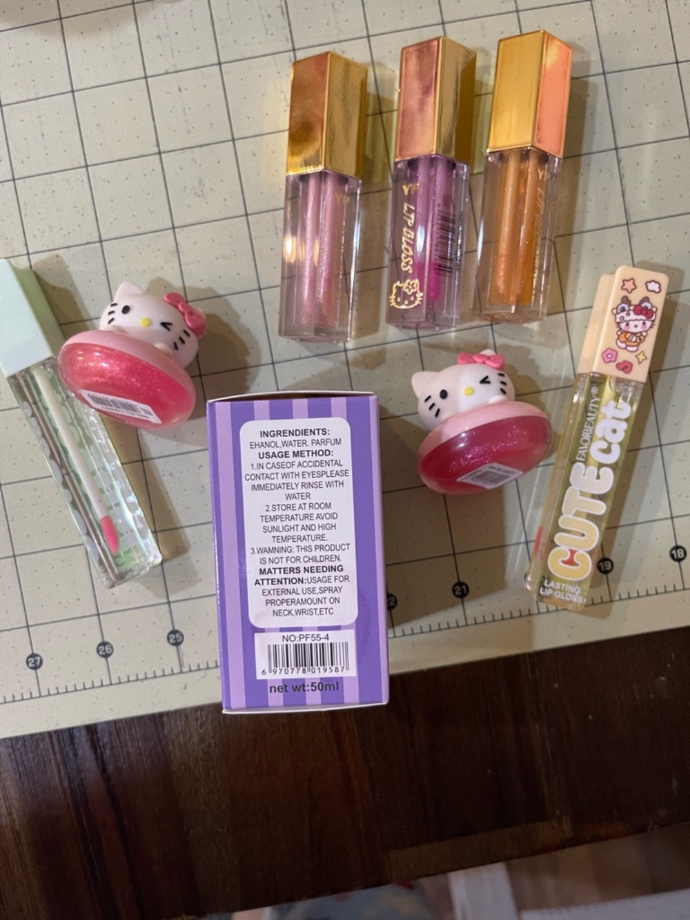 Hello Kitty themed Lip Gloss, balm, perfume in Pink, Purple, Gold - Picture 2 of 3